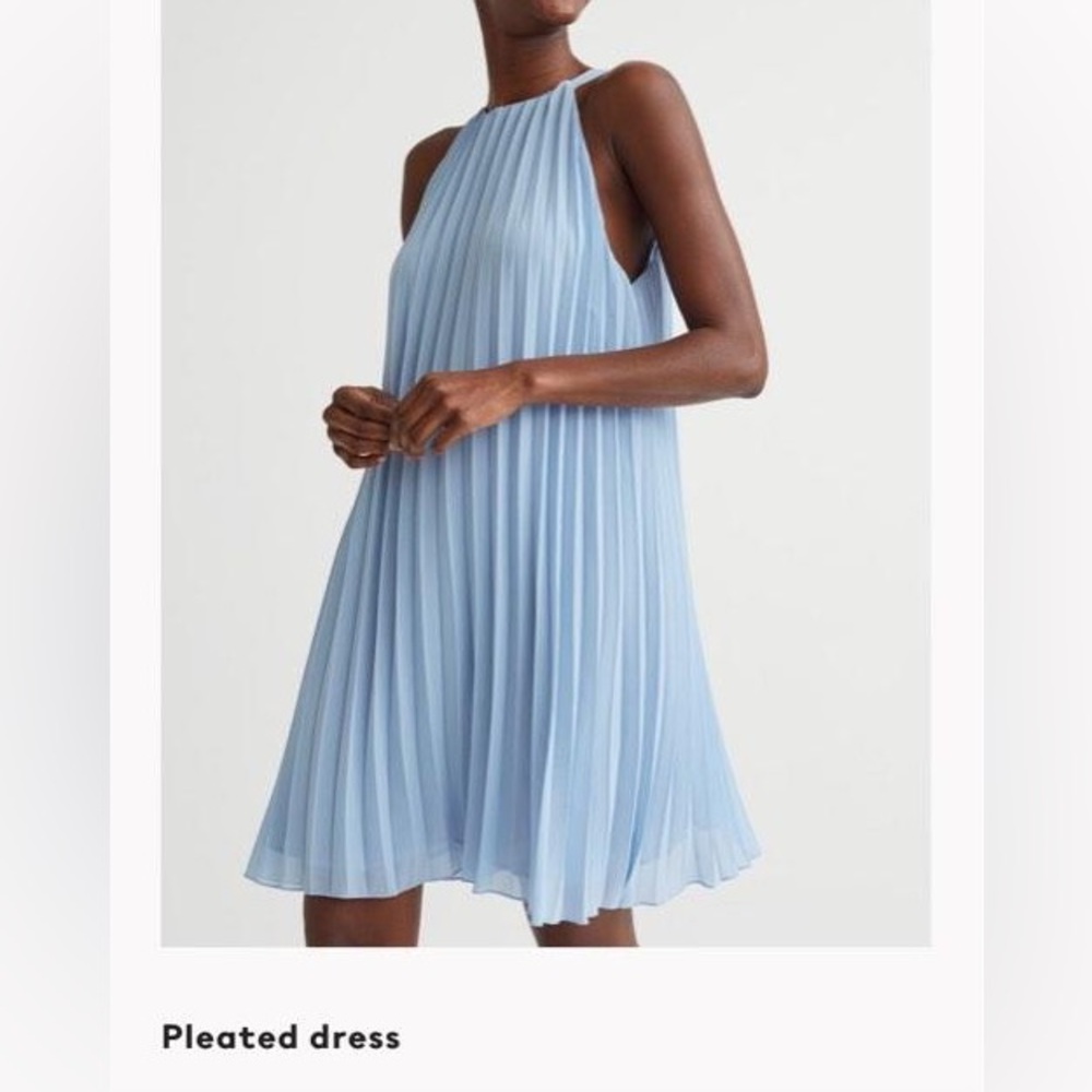 Periwinkle blue pleated dress with halter style neckline